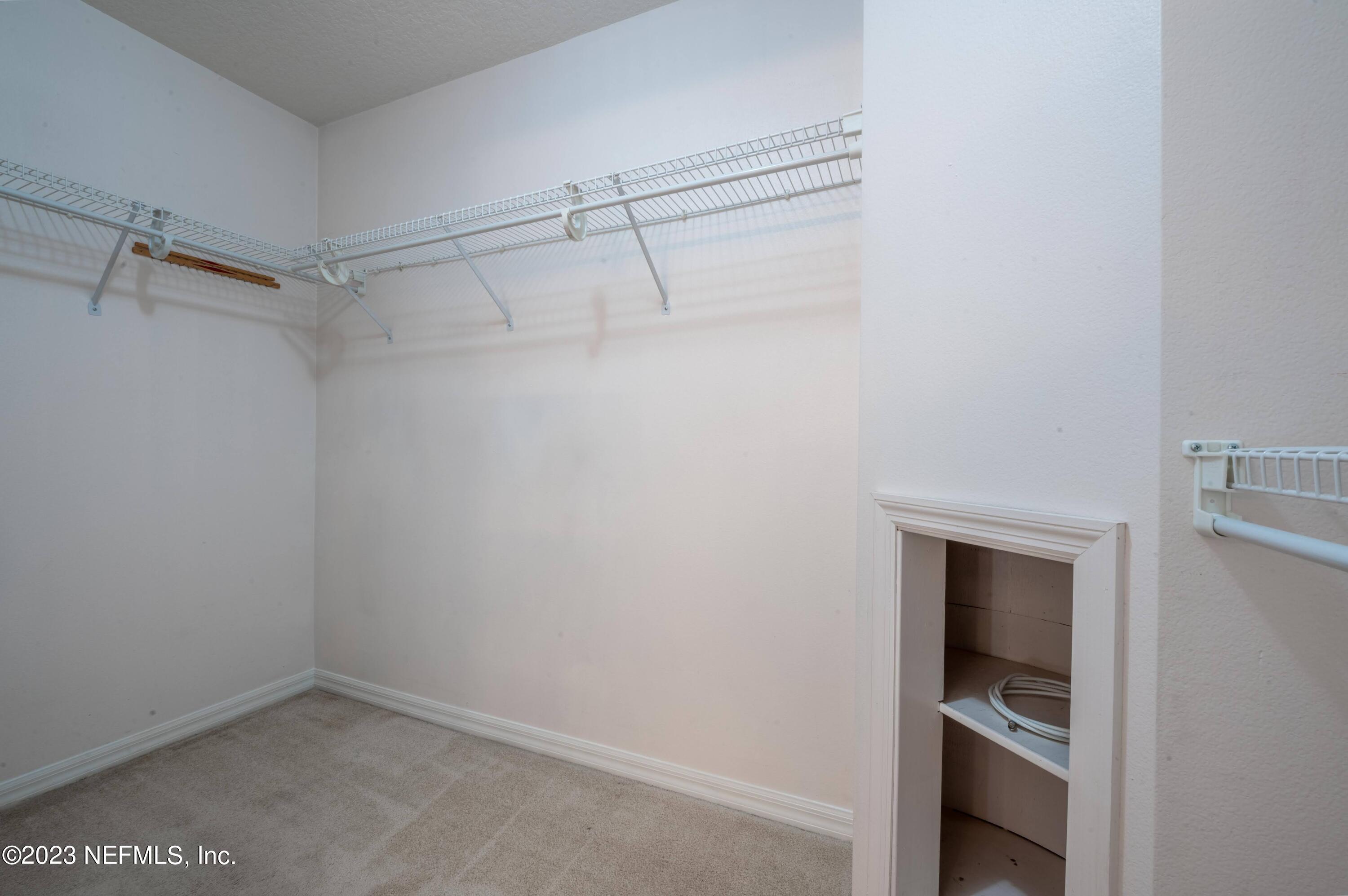 13 Clear Court Palm Coast, FL 32137 - Photo 38 of 60 a view of an empty walk in closet