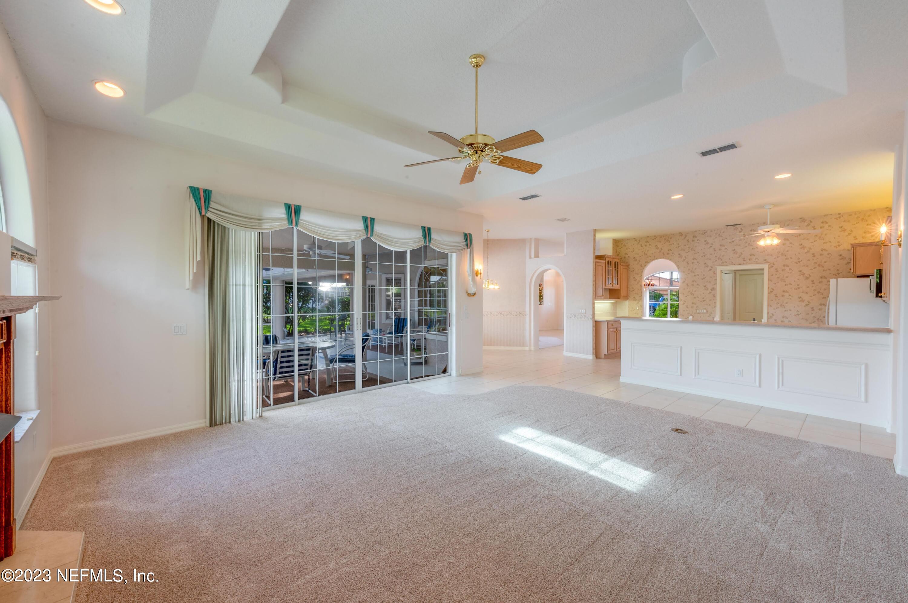 13 Clear Court Palm Coast, FL 32137 - Photo 53 of 60 a view of a livingroom with a ceiling fan