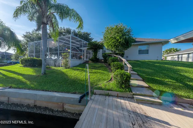 a view of a backyard with large trees