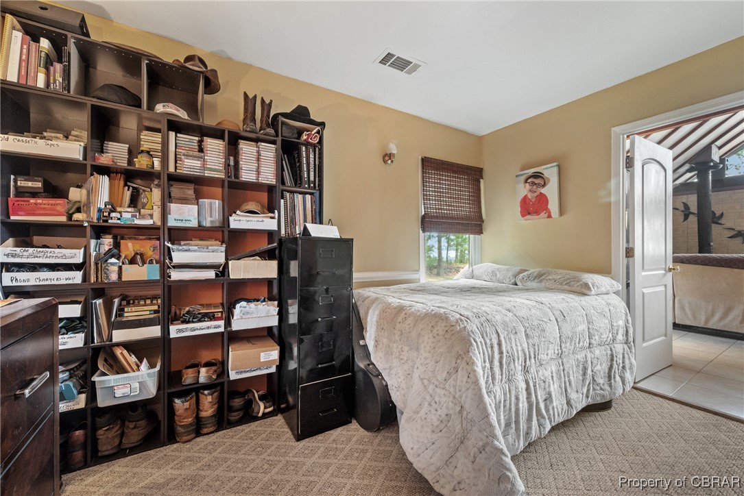 5447 Mobjack Road Gloucester, VA 23061 - Photo 11 of 40 Bedroom with light carpet