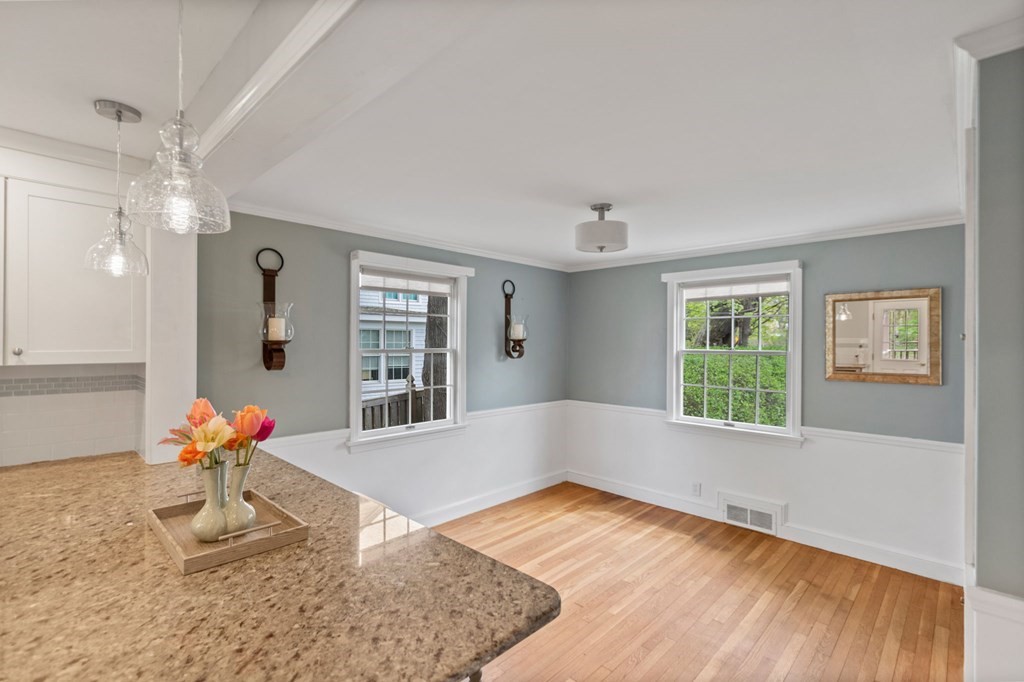 427 Main Street Hingham, MA 02043 - Photo 12 of 42 a view of an empty room with wooden floor and a window
