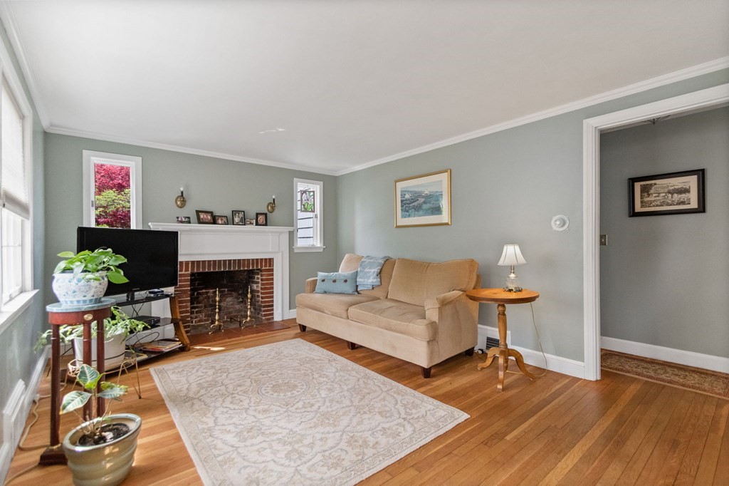 427 Main Street Hingham, MA 02043 - Photo 17 of 42 a living room with furniture and a fireplace