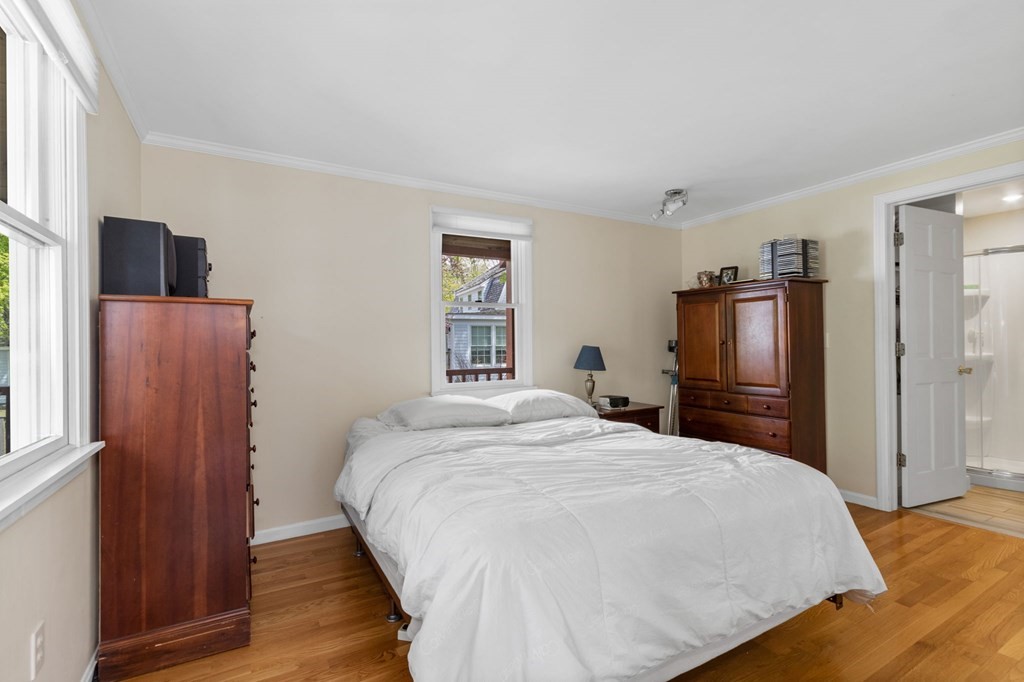 427 Main Street Hingham, MA 02043 - Photo 22 of 42 a bedroom with a bed and a flat screen tv