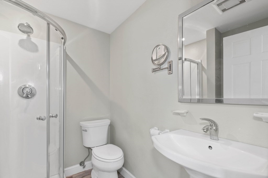 427 Main Street Hingham, MA 02043 - Photo 23 of 42 a bathroom with a toilet sink and shower