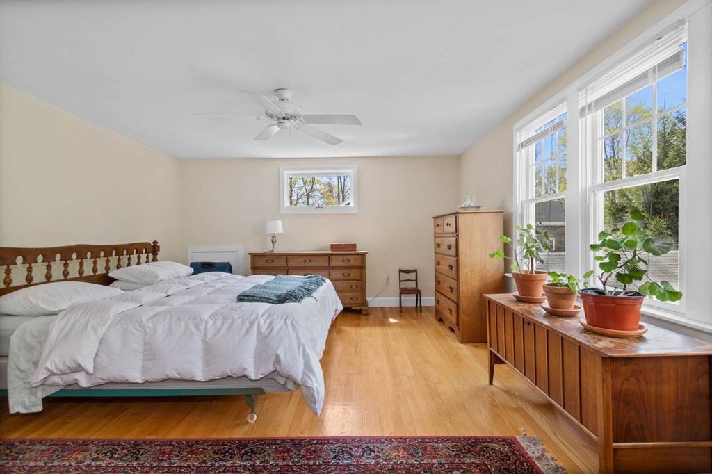 427 Main Street Hingham, MA 02043 - Photo 25 of 42 a bedroom with a bed and wooden floor