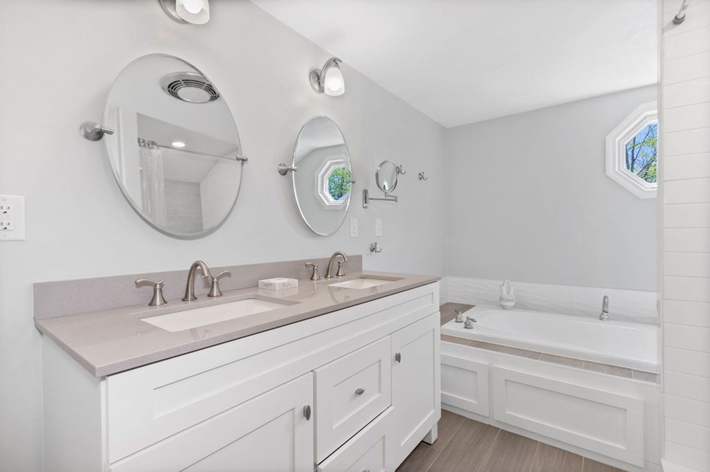 427 Main Street Hingham, MA 02043 - Photo 28 of 42 a bathroom with a double vanity sink and a mirror