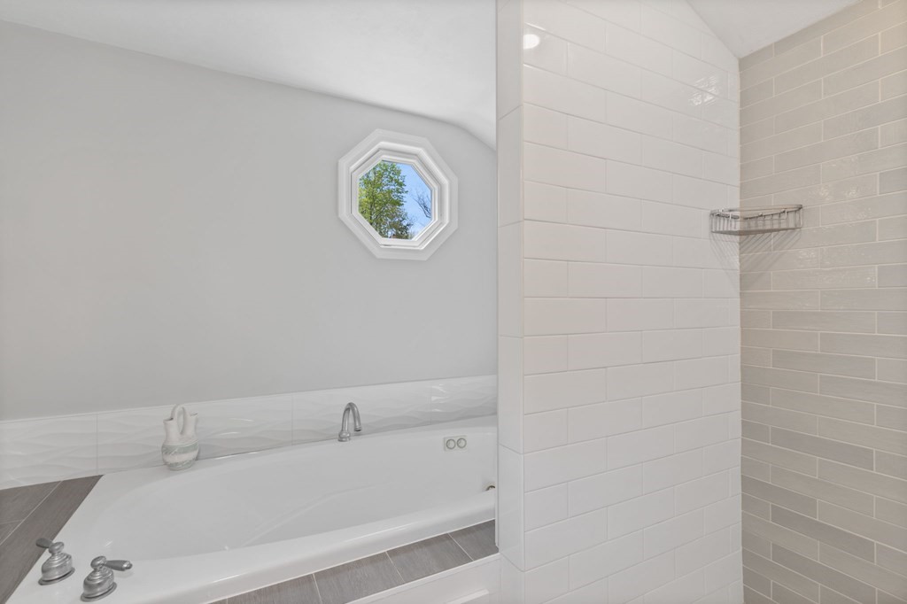 427 Main Street Hingham, MA 02043 - Photo 29 of 42 a bathroom with a bathtub and a sink