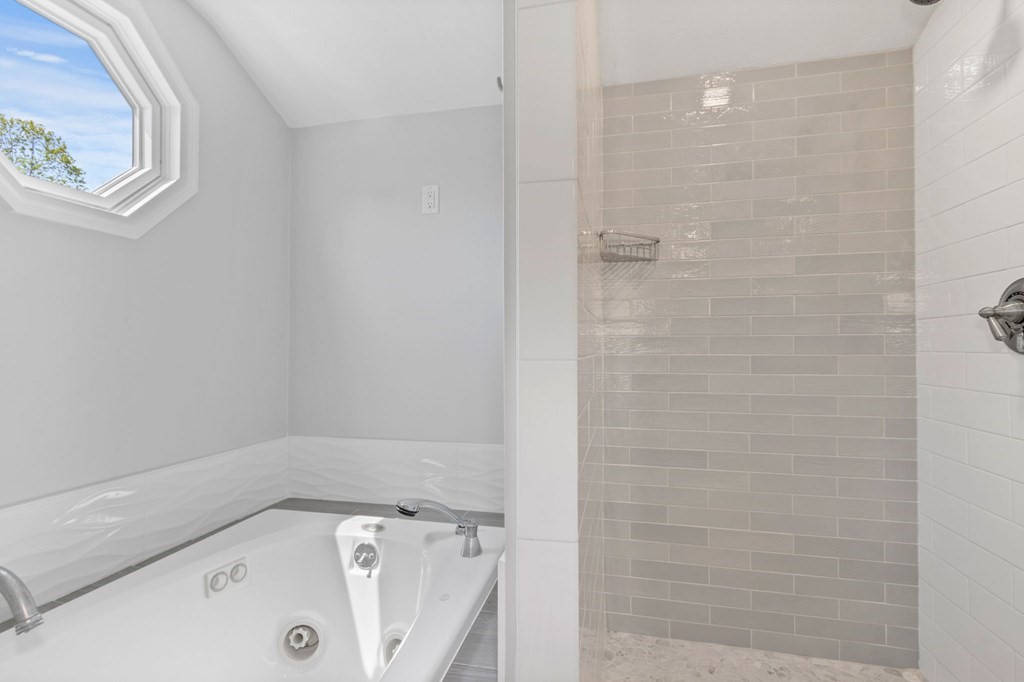 427 Main Street Hingham, MA 02043 - Photo 30 of 42 a bathroom with a bathtub and shower