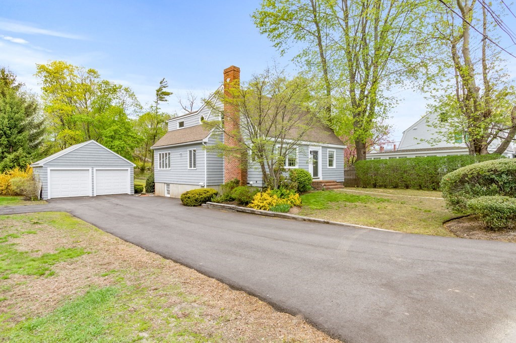 427 Main Street Hingham, MA 02043 - Photo 3 of 42 a front view of house with yard and trees around