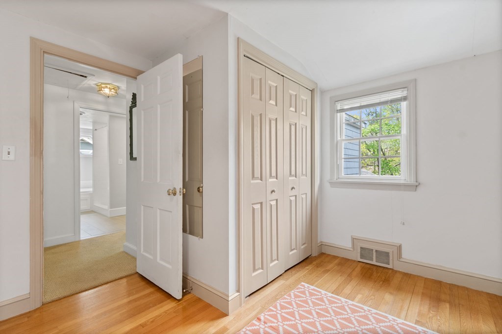 427 Main Street Hingham, MA 02043 - Photo 33 of 42 a view of a bedroom with wooden floor and a window