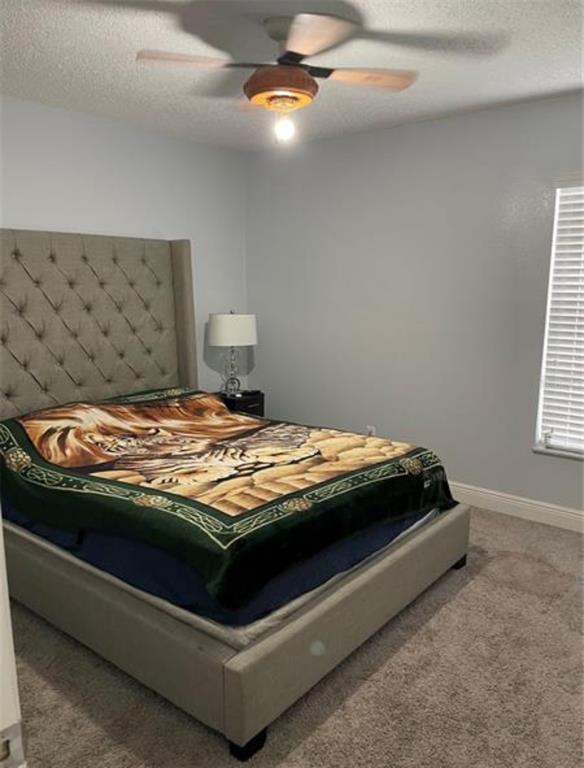 6125 Mariner Boulevard Spring Hill, FL 34608 - Photo 16 of 24 a bedroom with bed and window