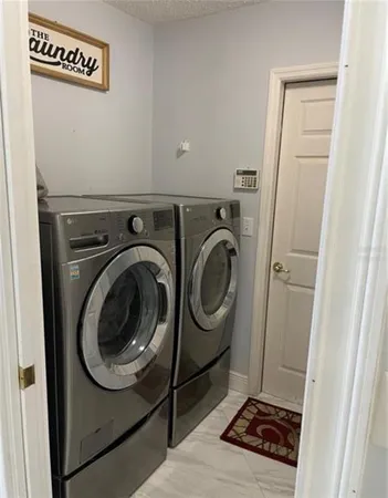 a utility room with dryer and washer