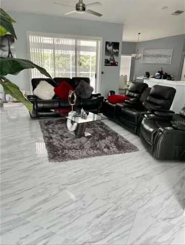 a living room with furniture hard wood floor