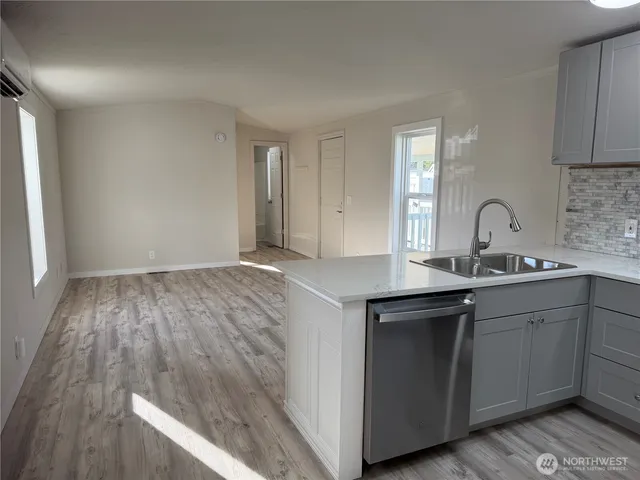 a kitchen with sink and cabinets