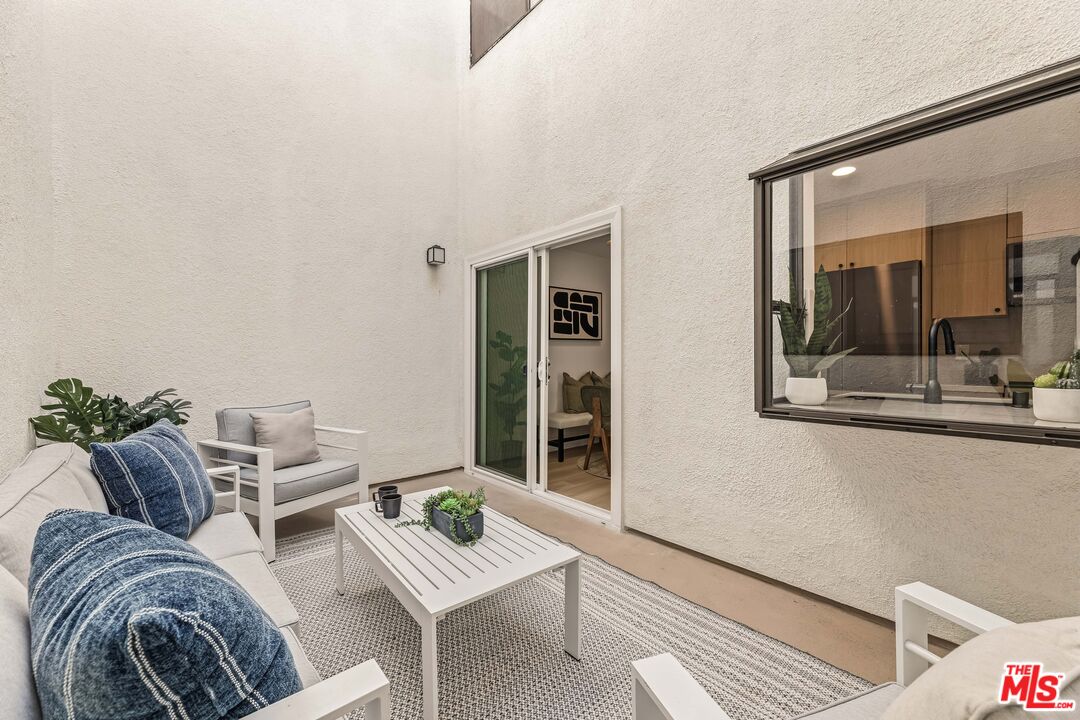 311 Bora Bora Way, Unit 3207 Marina del Rey, CA 90292 - Photo 20 of 54 a living room with furniture and a window