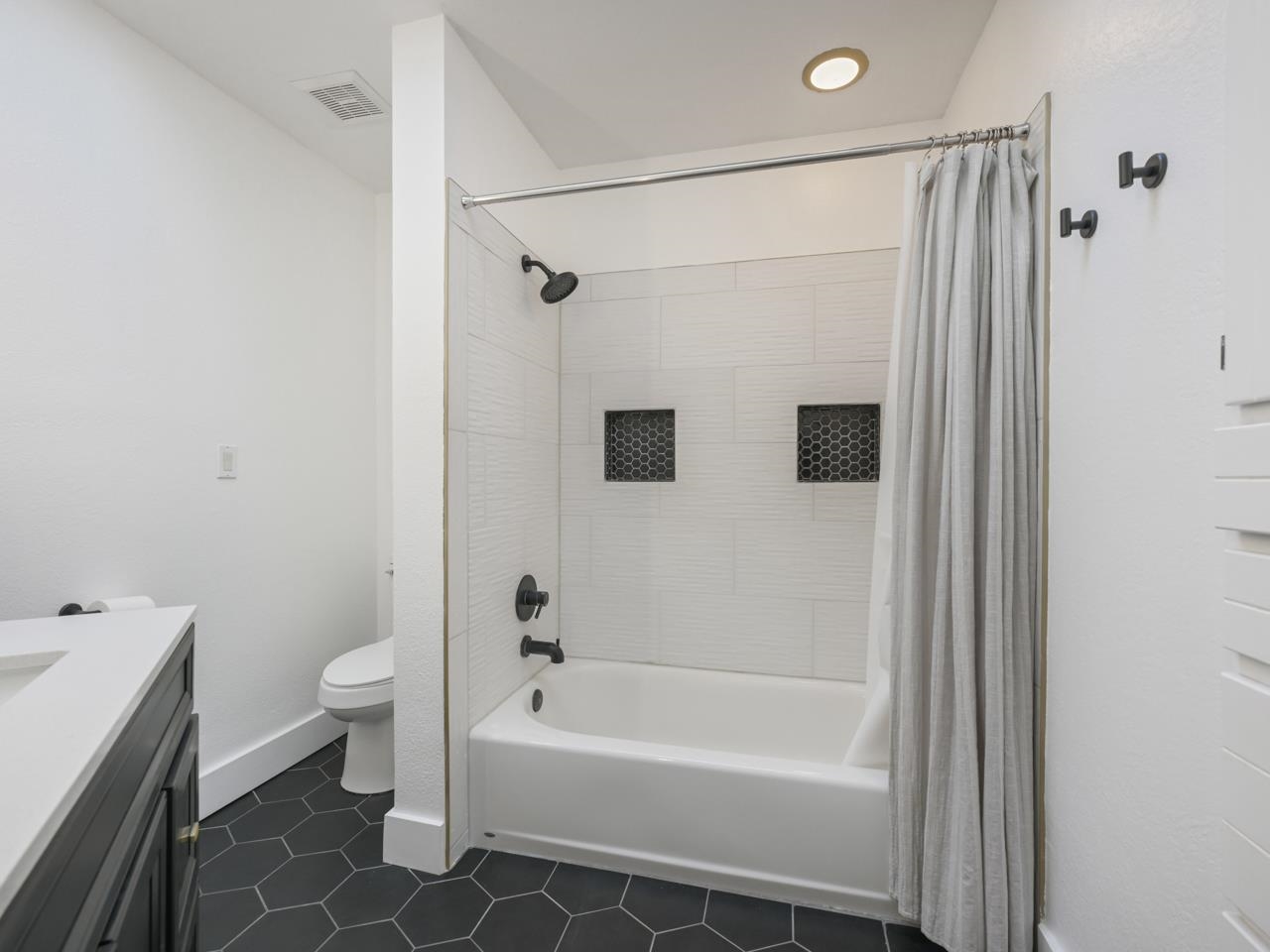 383 Explorer Court, Unit B Grand Junction, CO 81507 - Photo 24 of 40 a bathroom with a bathtub a toilet and a shower