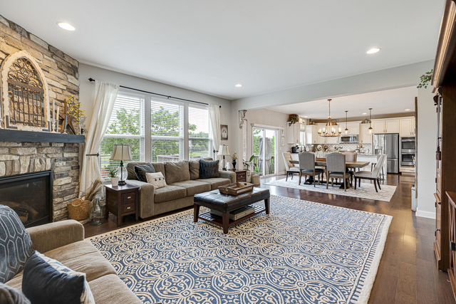 4380 John Milton Road Elgin, IL 60124 - Photo 11 of 30 a living room with furniture and a fireplace