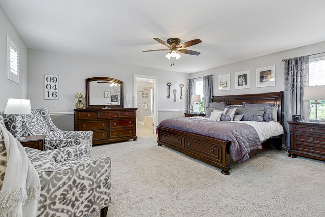 4380 John Milton Road Elgin, IL 60124 - Photo 16 of 30 a bedroom with a bed and dresser