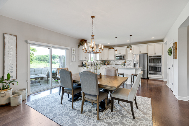 4380 John Milton Road Elgin, IL 60124 - Photo 5 of 30 a view of a dining room with furniture window and wooden floor
