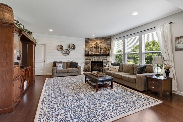 4380 John Milton Road Elgin, IL 60124 - Photo 9 of 30 a living room with furniture and a fireplace