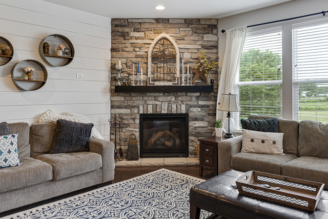 4380 John Milton Road Elgin, IL 60124 - Photo 10 of 30 a living room with furniture a large window and a fireplace