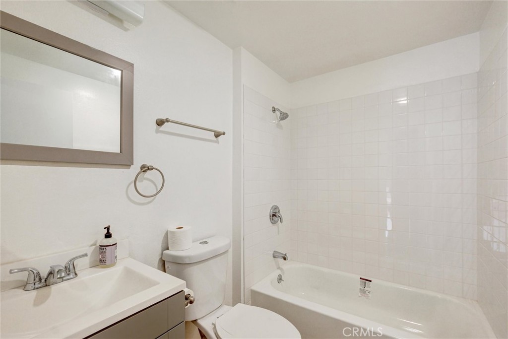 7033 Stewart And Gray Road, Unit 24 Downey, CA 90241 - Photo 15 of 39 a bathroom with a sink toilet and shower