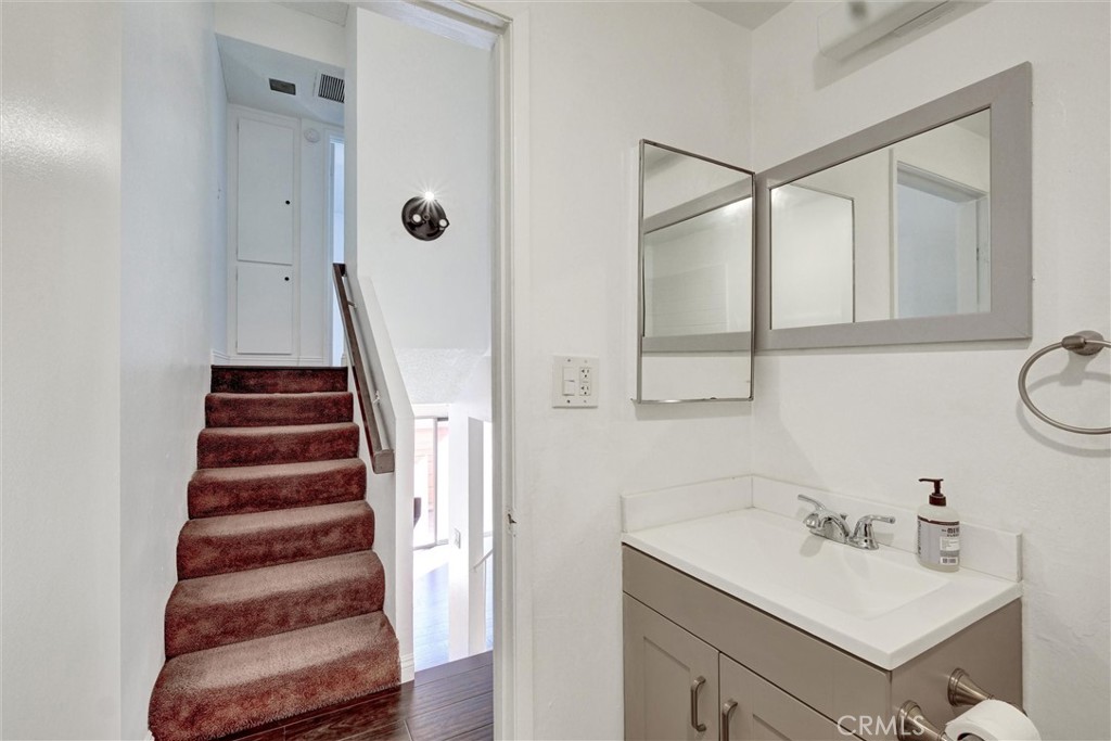7033 Stewart And Gray Road, Unit 24 Downey, CA 90241 - Photo 16 of 39 a bathroom with a sink and a mirror