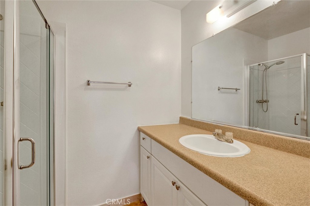 7033 Stewart And Gray Road, Unit 24 Downey, CA 90241 - Photo 21 of 39 a bathroom with a sink and a mirror