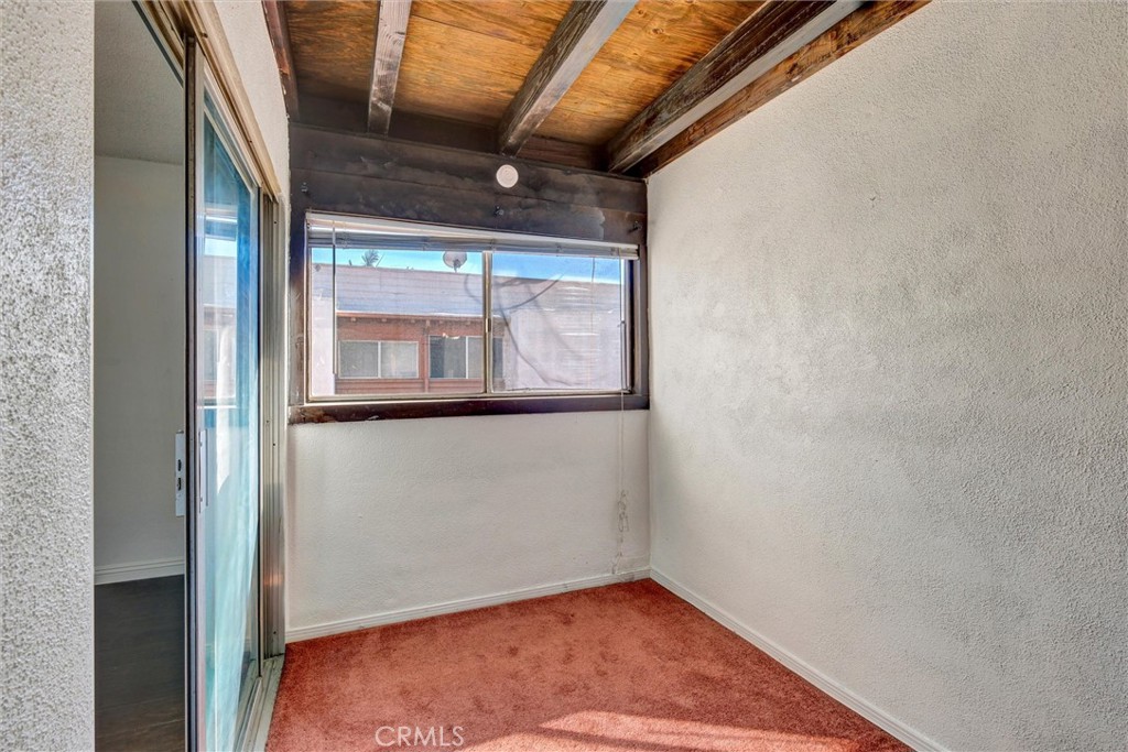 7033 Stewart And Gray Road, Unit 24 Downey, CA 90241 - Photo 25 of 39 a view of empty room with wooden floor and fan