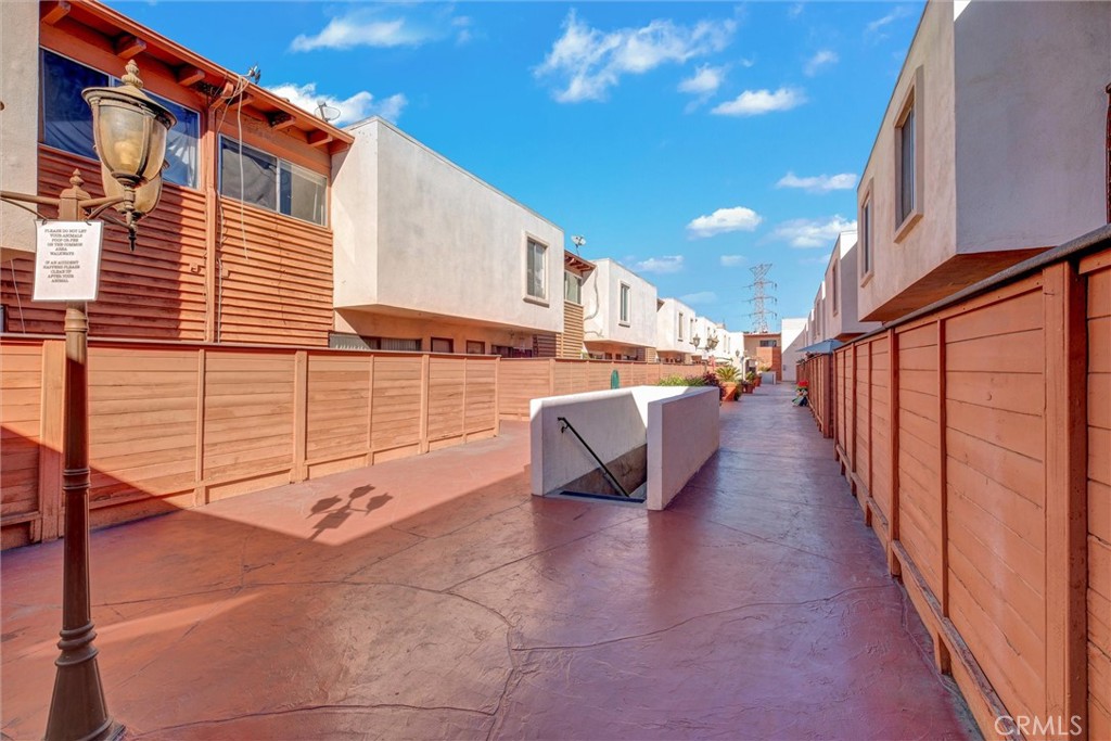 7033 Stewart And Gray Road, Unit 24 Downey, CA 90241 - Photo 27 of 39 a view of a patio with table and chairs
