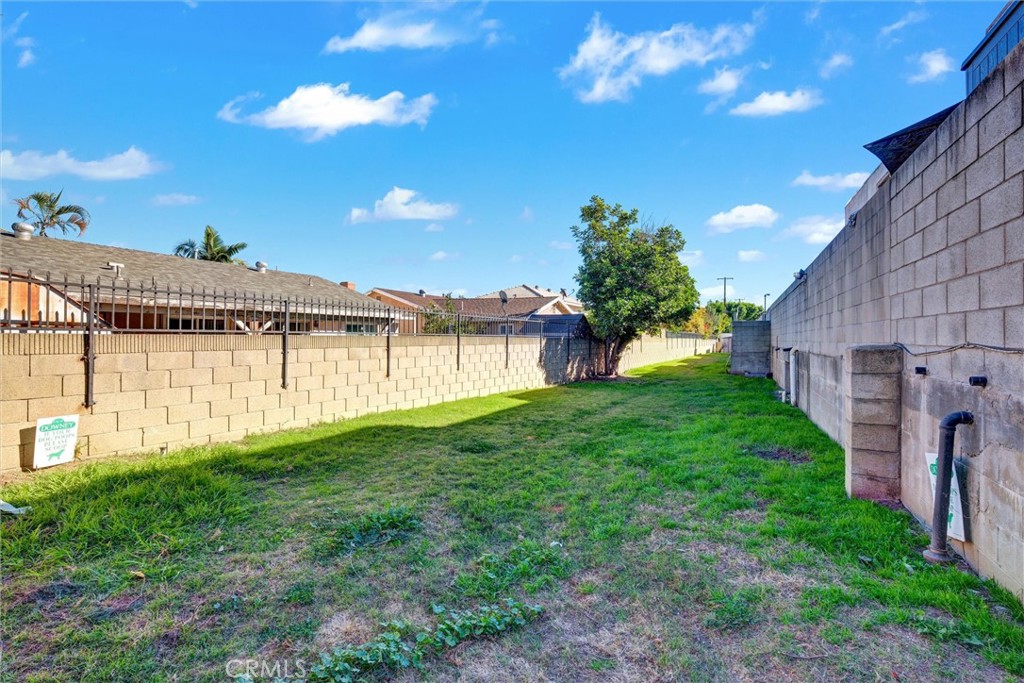 7033 Stewart And Gray Road, Unit 24 Downey, CA 90241 - Photo 30 of 39 a view of a backyard with plants and a garden