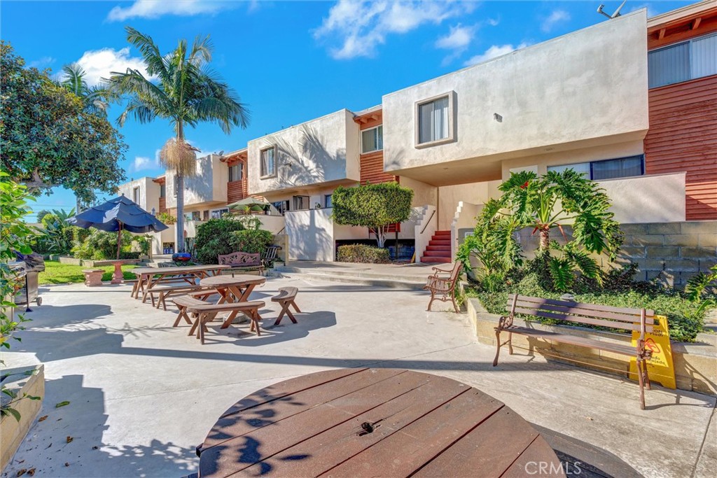 7033 Stewart And Gray Road, Unit 24 Downey, CA 90241 - Photo 34 of 39 a front view of a house with sitting area