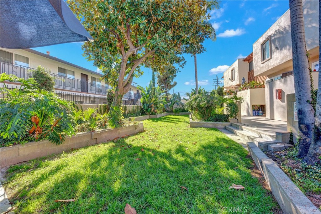 7033 Stewart And Gray Road, Unit 24 Downey, CA 90241 - Photo 36 of 39 a view of a house with a yard and plants
