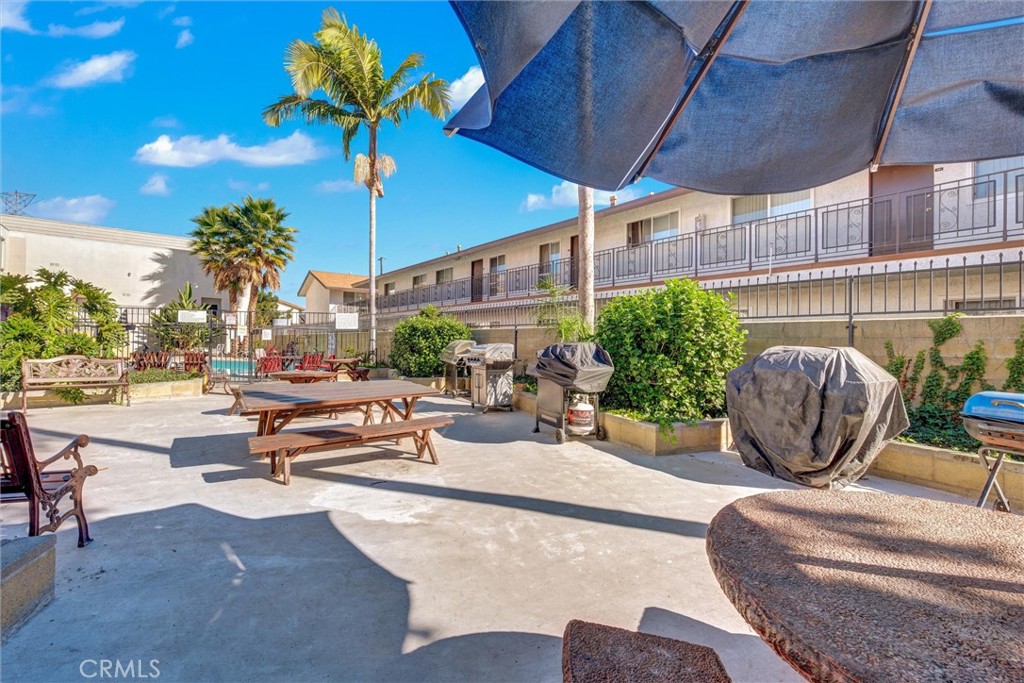 7033 Stewart And Gray Road, Unit 24 Downey, CA 90241 - Photo 37 of 39 a living room with patio furniture