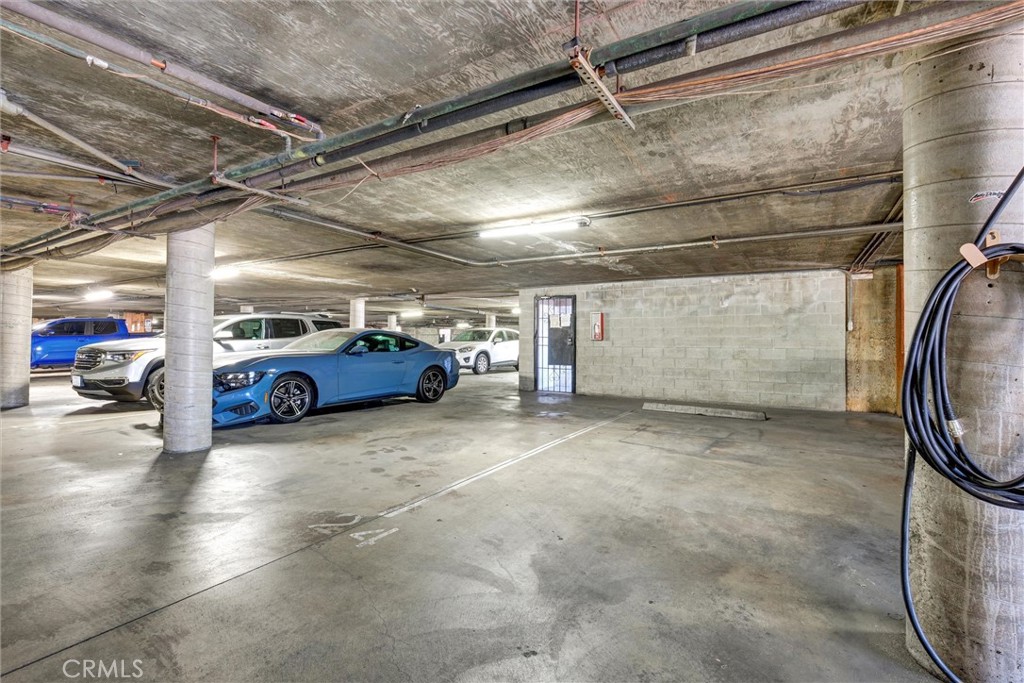 7033 Stewart And Gray Road, Unit 24 Downey, CA 90241 - Photo 38 of 39 a view of parking garage with cars