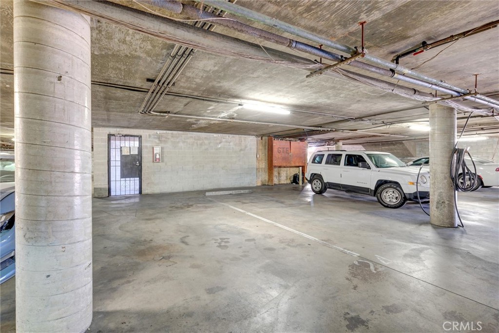 7033 Stewart And Gray Road, Unit 24 Downey, CA 90241 - Photo 39 of 39 a view of parking garage with cars parked