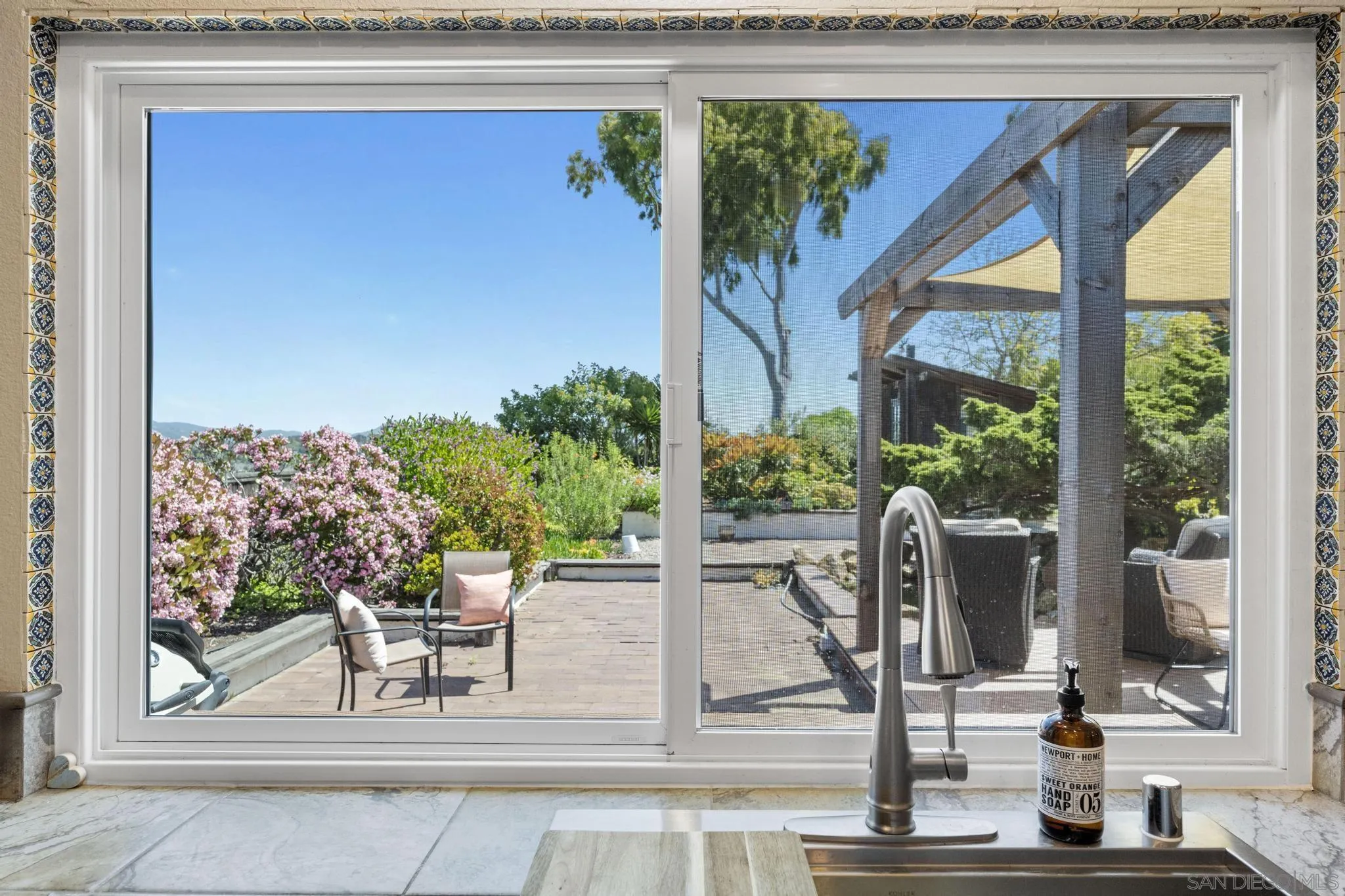 149 Beechtree Drive Encinitas, CA 92024 - Photo 16 of 55 a view of a porch with chairs and backyard