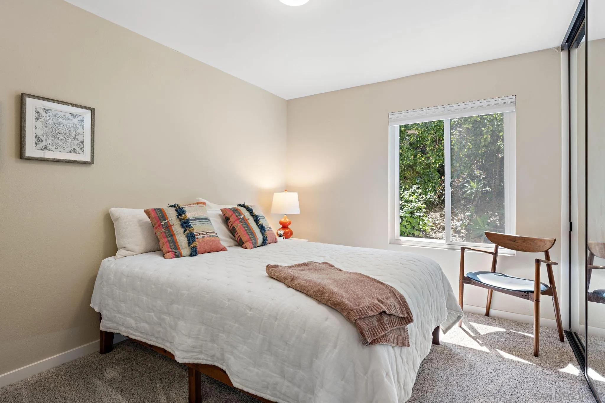 149 Beechtree Drive Encinitas, CA 92024 - Photo 21 of 55 a bedroom with a bed and a large window
