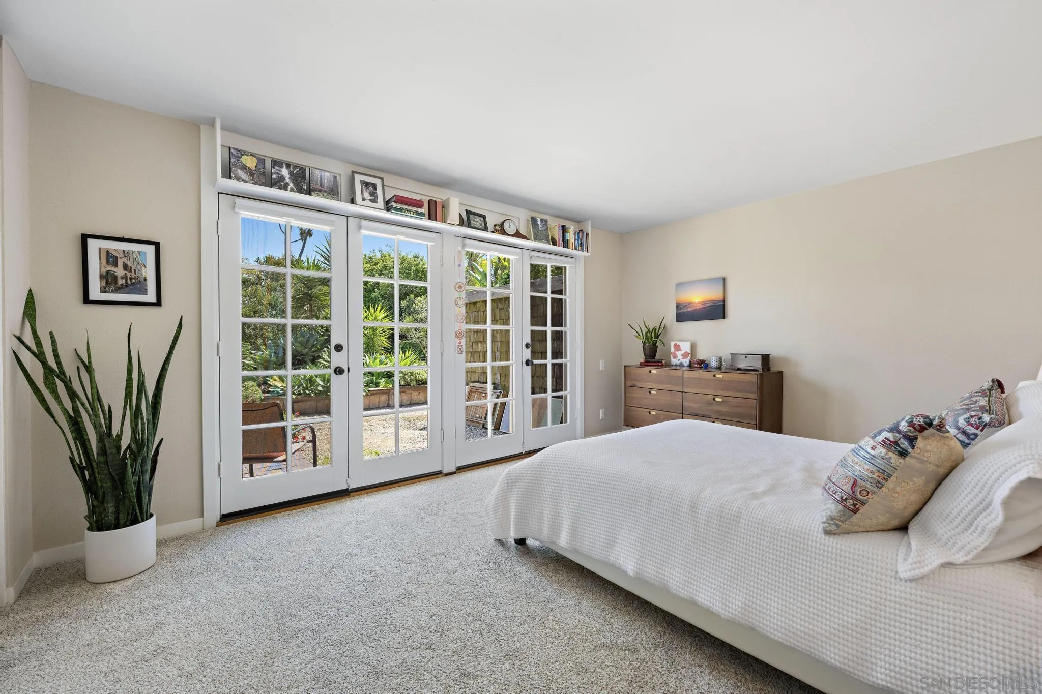 149 Beechtree Drive Encinitas, CA 92024 - Photo 23 of 55 a bedroom with a bed and a large window