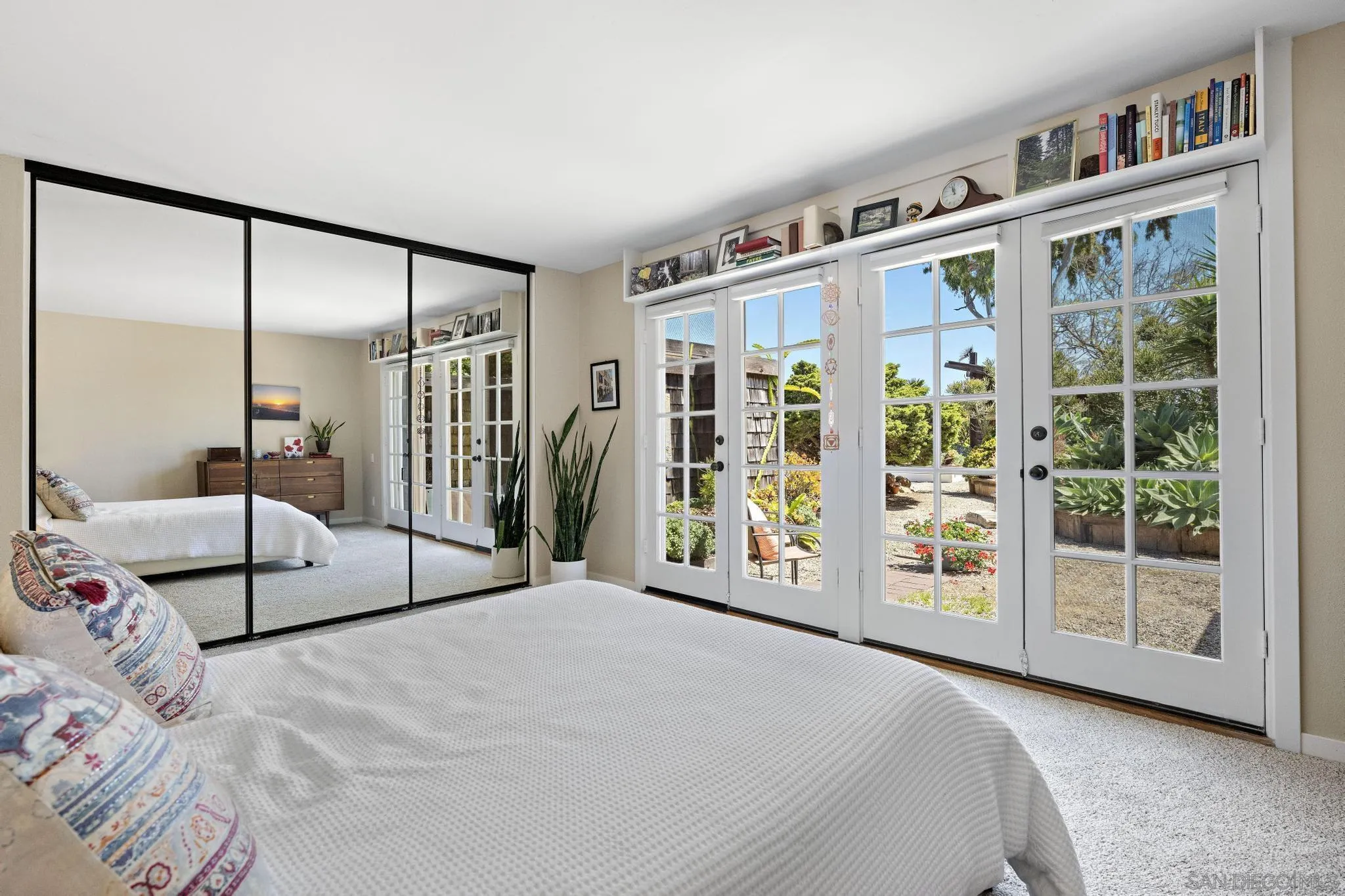 149 Beechtree Drive Encinitas, CA 92024 - Photo 25 of 55 a bedroom with a large bed and a large window