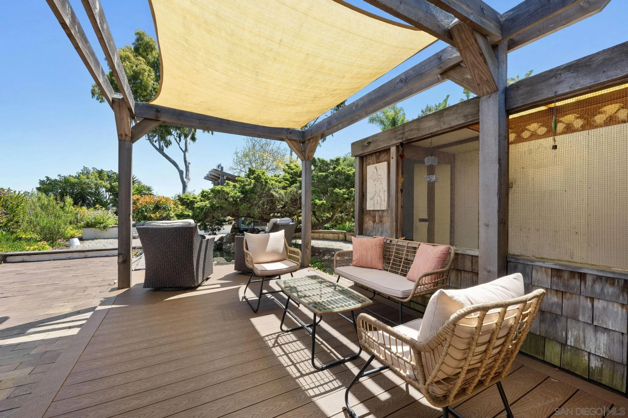 149 Beechtree Drive Encinitas, CA 92024 - Photo 28 of 55 a view of a patio with couches and potted plants