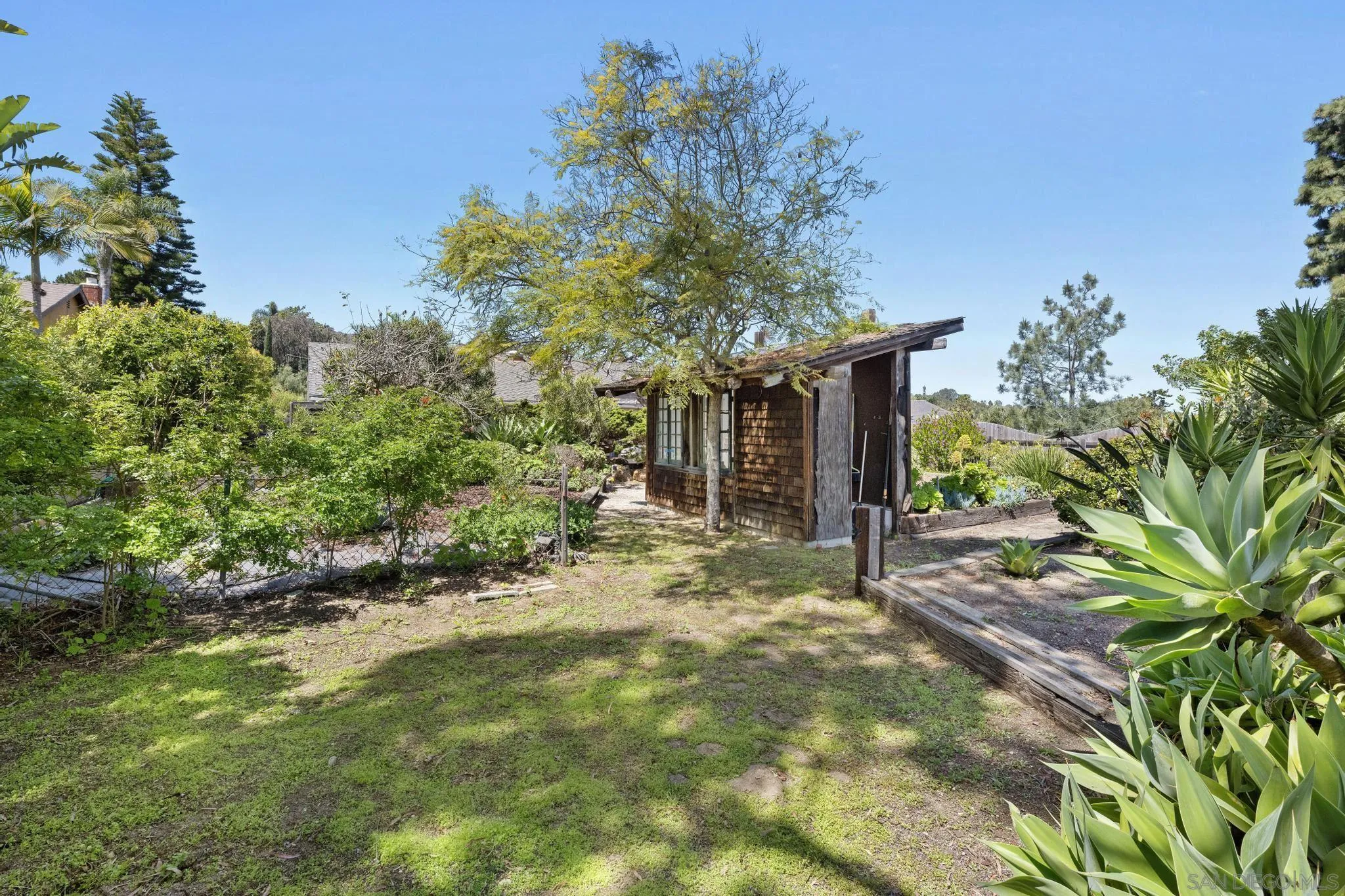 149 Beechtree Drive Encinitas, CA 92024 - Photo 34 of 55 a yellow house with lots of trees