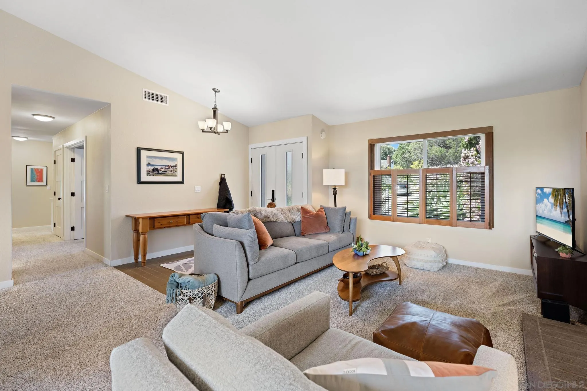 149 Beechtree Drive Encinitas, CA 92024 - Photo 8 of 55 a living room with furniture and a flat screen tv