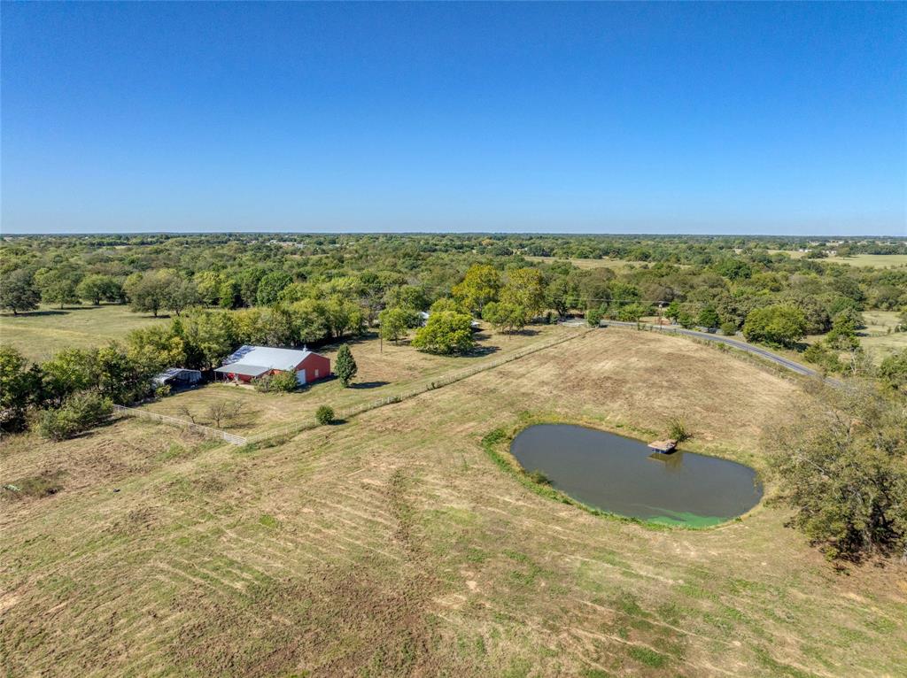 4231 Spalding Road Sherman, TX 75092 - Photo 12 of 13 Overview of rural landscape featuring a large body of water and a heavily wooded area