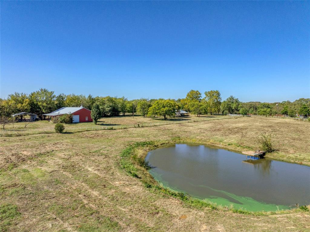 4231 Spalding Road Sherman, TX 75092 - Photo 4 of 13 Pond and barndominium