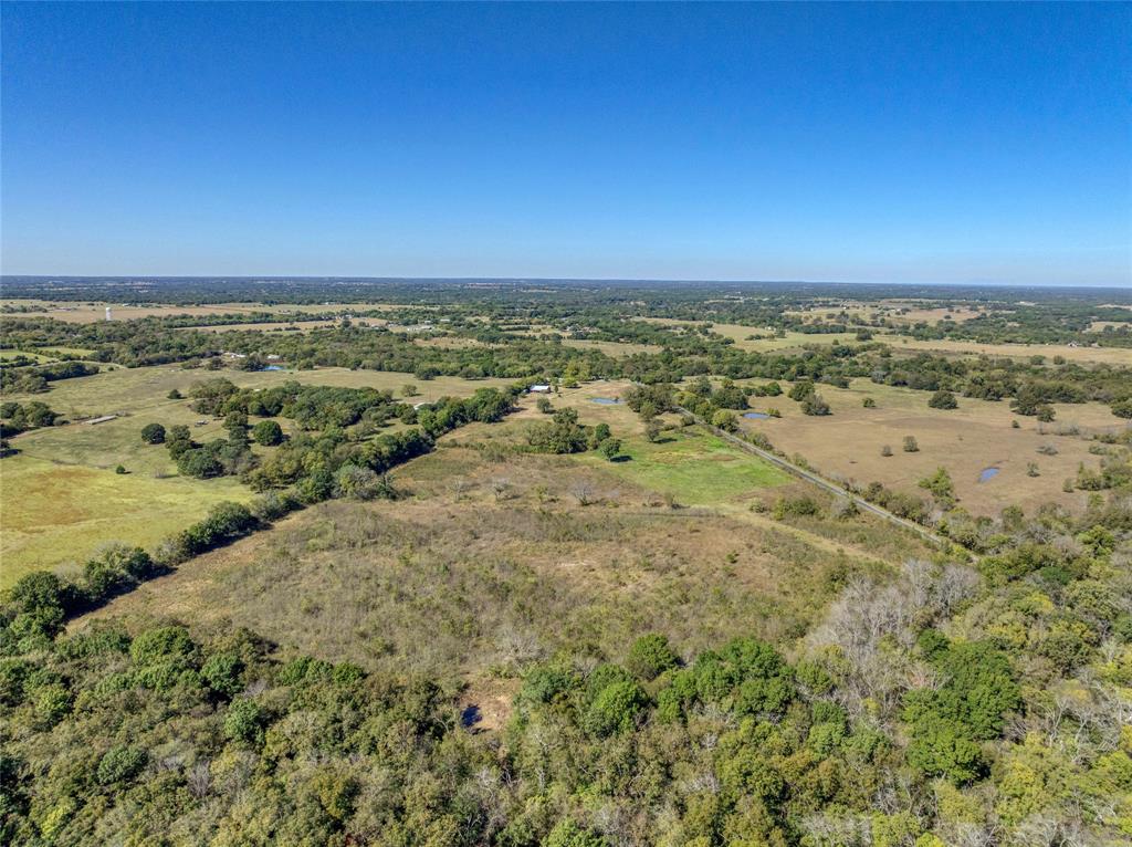 4231 Spalding Road Sherman, TX 75092 - Photo 9 of 13 View of rural area featuring a forest
