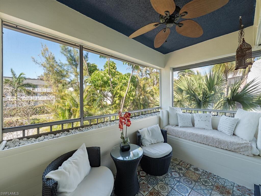 39 Watercolor Way, Unit 39 Naples, FL 34113 - Photo 11 of 12 Sunroom featuring an outdoor living space, a healthy amount of sunlight, and a ceiling fan