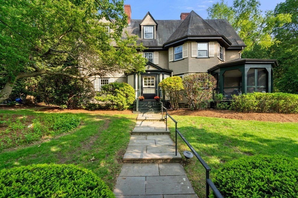 a front view of a house with a yard