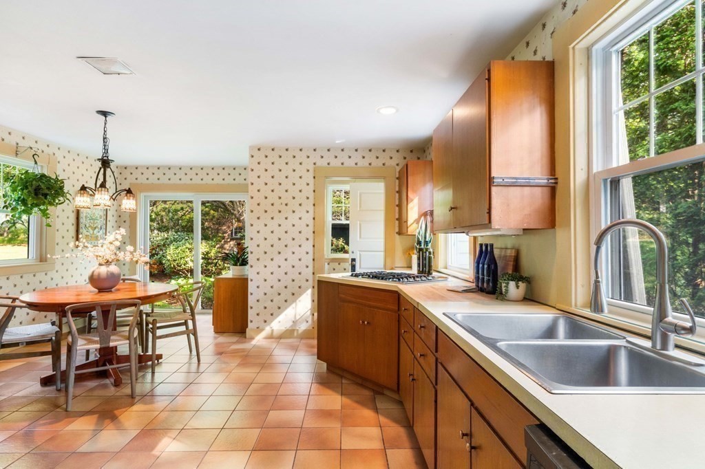 24 Percy Road Lexington, MA 02421 - Photo 14 of 38 a kitchen with granite countertop a sink and a counter top space