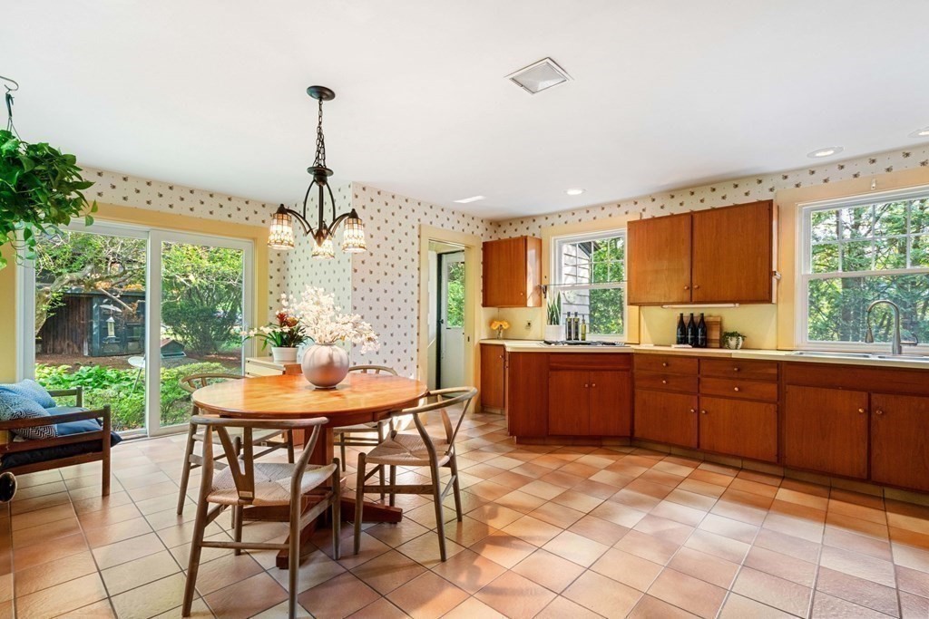 24 Percy Road Lexington, MA 02421 - Photo 15 of 38 a kitchen with a table and chairs in it